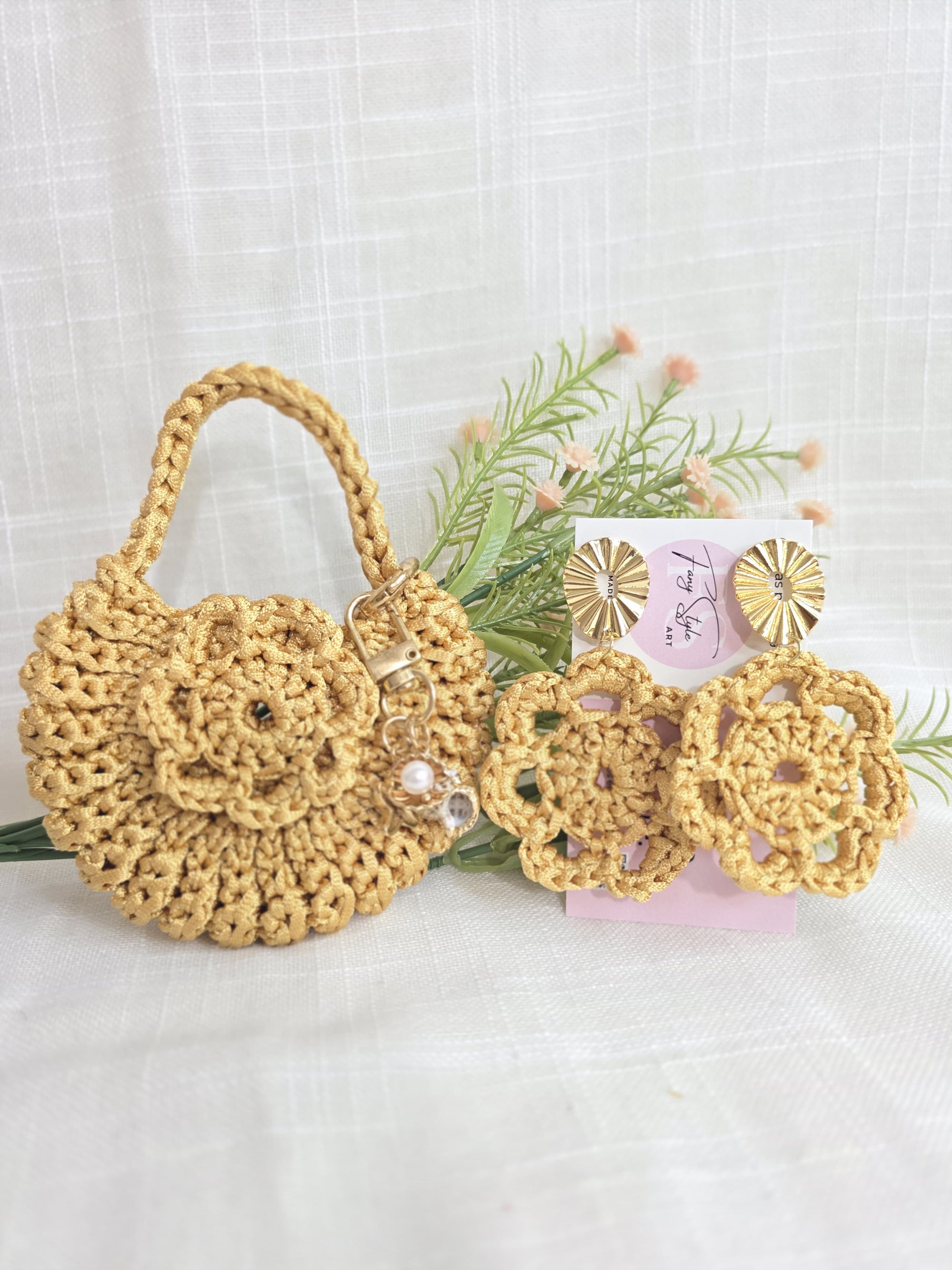 Juego de monedero y aretes